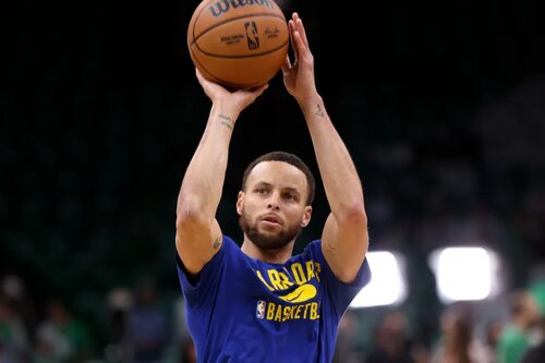 This is a photo of Steph Curry of the Golden State Warriors shooting a basketball