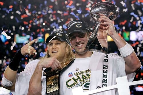 This is a picture of Aaron Rodgers celebrating the Packers Super Bowl trophy back in 2011 for the Super Bowl LVIII Favorites article 