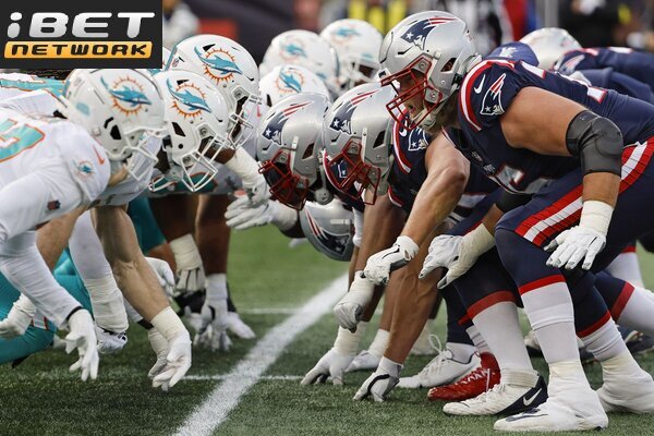 This a picture of the Patriots against the Dolphins for the NFL Picks week 5 article preview